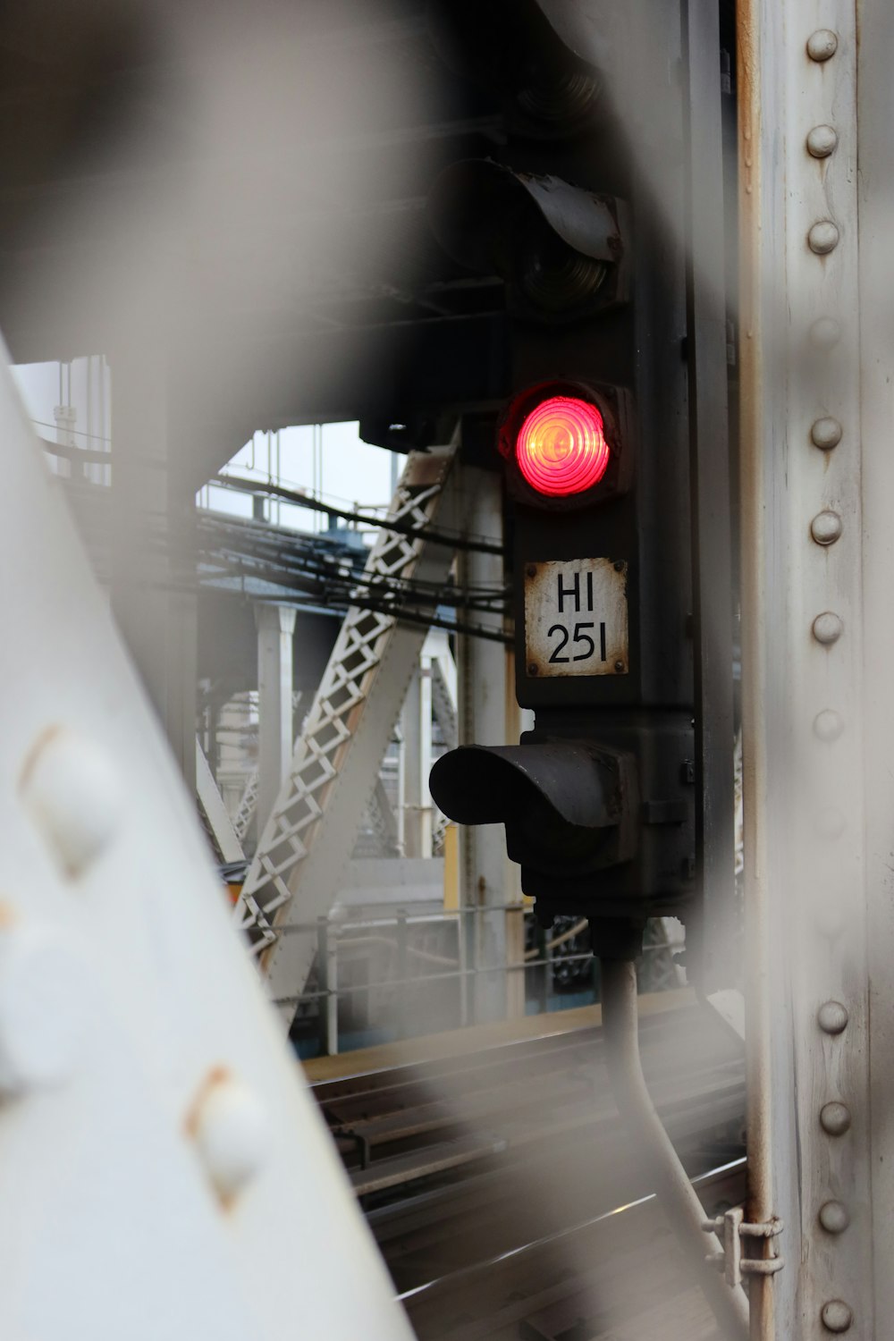 a red traffic light sitting on the side of a train