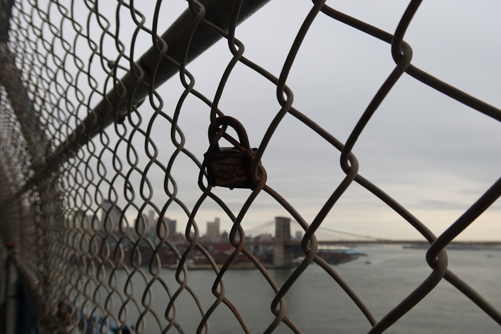 a chain link fence with a lock on it