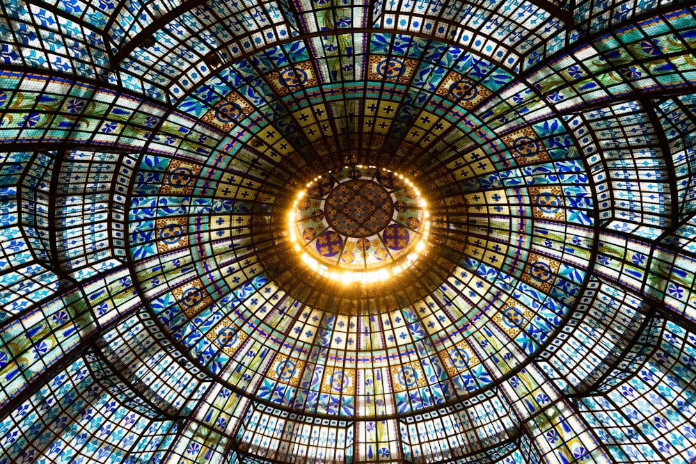 a circular stained glass window in a building