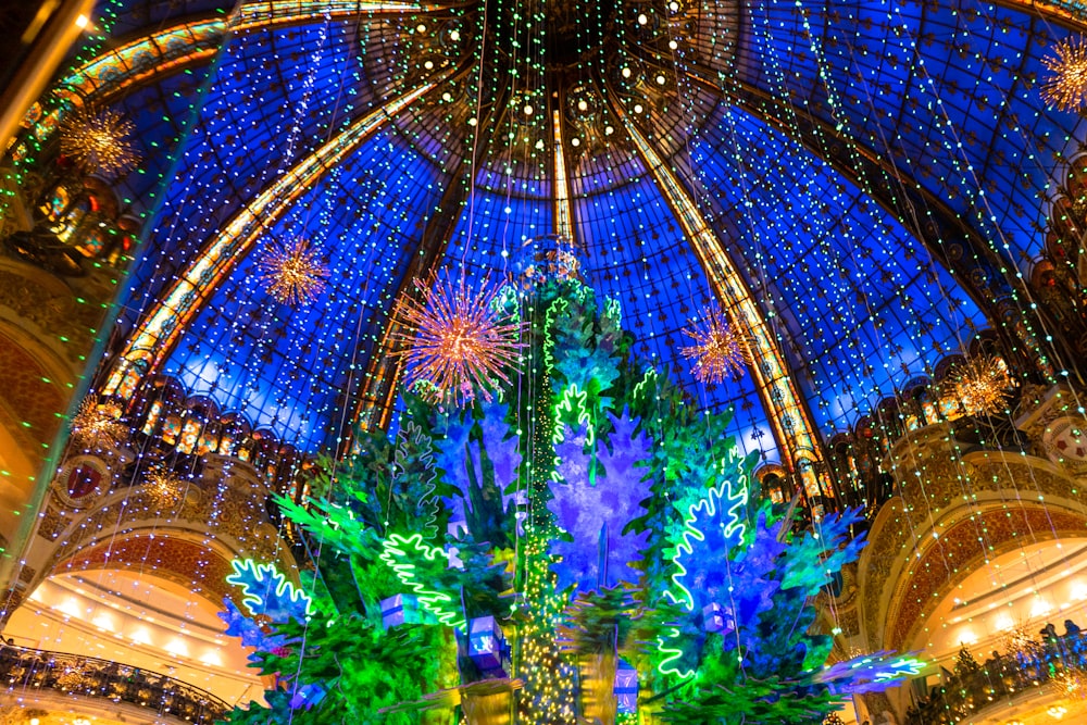 a large christmas tree in the middle of a building