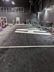 A vibrant gym space featuring various fitness equipment and inflatable gym items for active lifestyles.