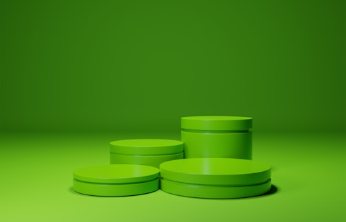 A close-up of green biofuel containers lined up in a warehouse.