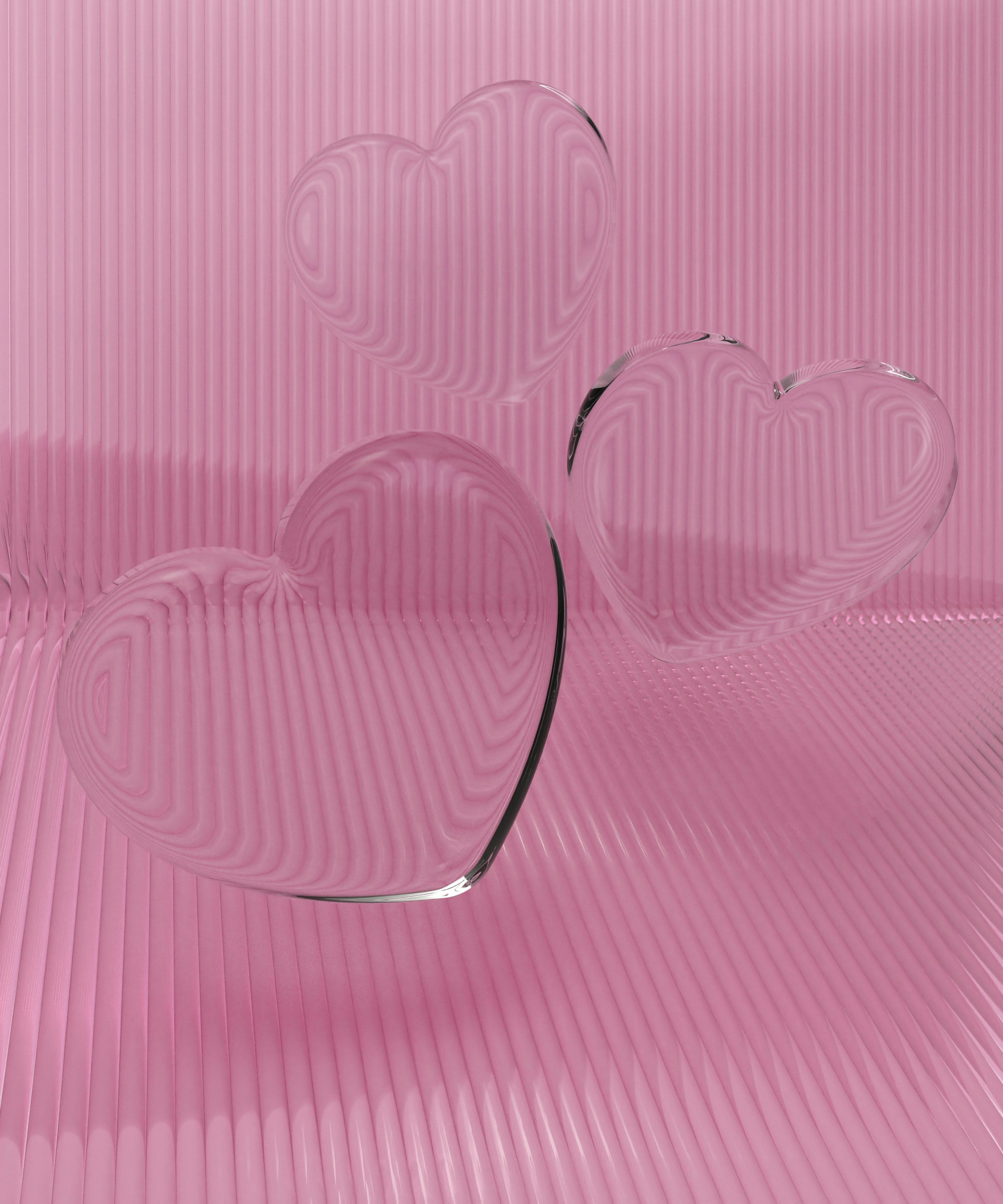 a couple of heart shaped glasses sitting on top of a table