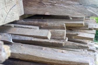 a pile of wood sitting on top of a wooden floor represeting manliness