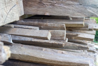 a pile of wood sitting on top of a wooden floor represeting manliness