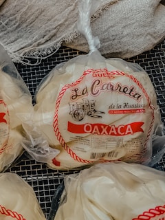 a couple of bags of cheese sitting on top of a table