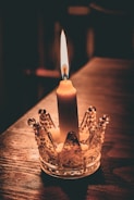 An elegant candle holder displayed on a wooden table.