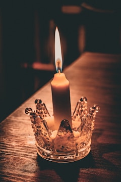 An elegant candle holder displayed on a wooden table.