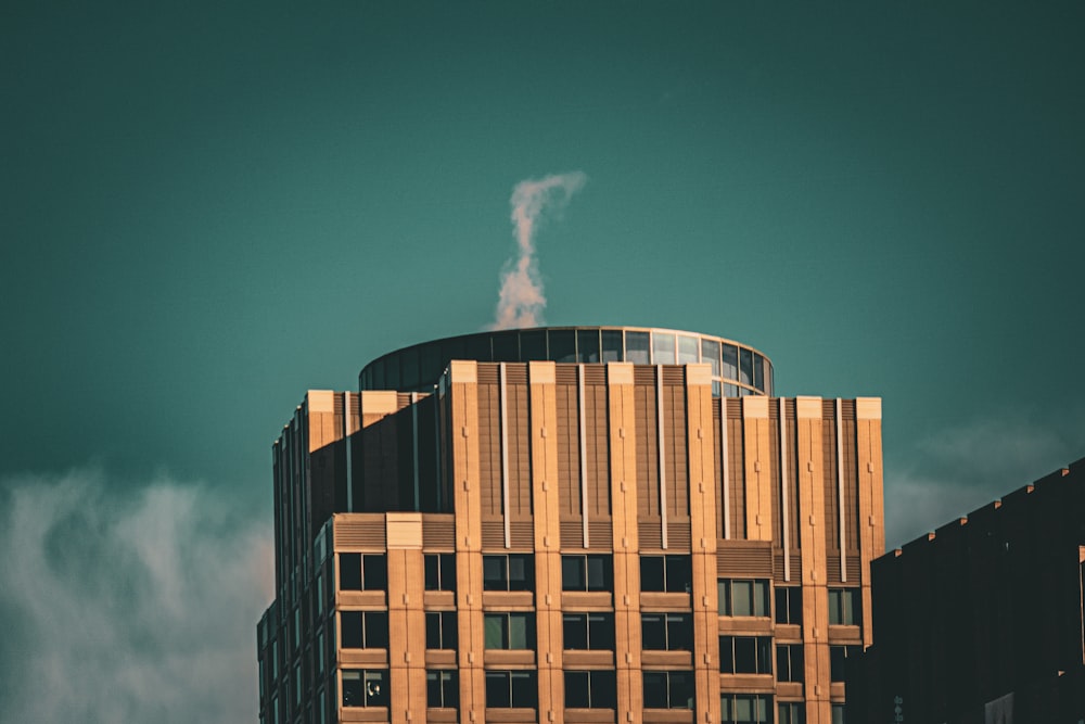 a tall building with a smoke stack sticking out of it's top
