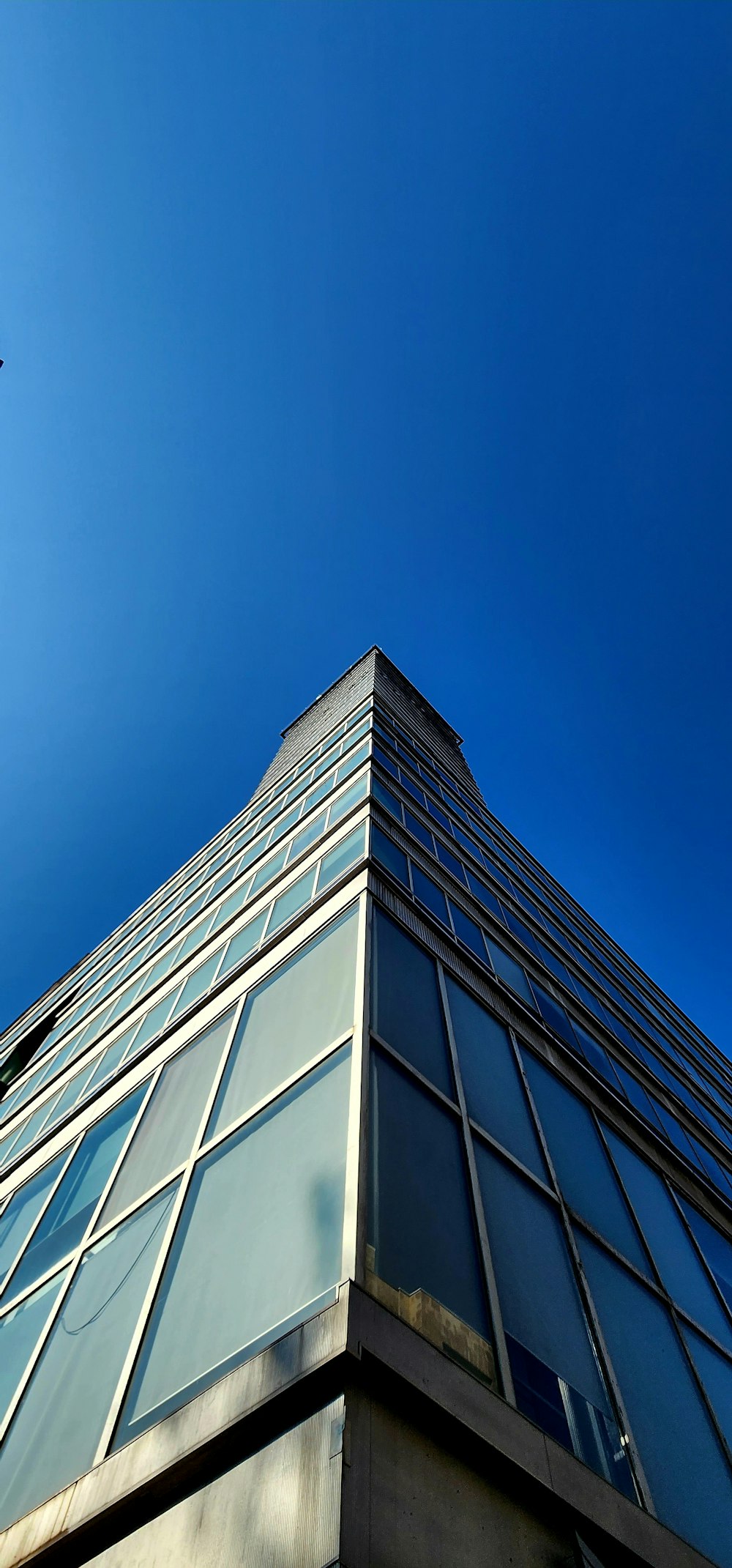 a tall building with lots of windows on top of it