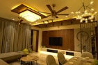 Brightly lit living room featuring smart plugs and electric fans.