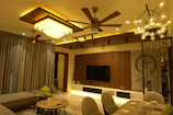 Installation of ceiling fan and lighting fixtures in a cozy living room.
