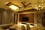 A modern living room with stylish lighting fixtures.
