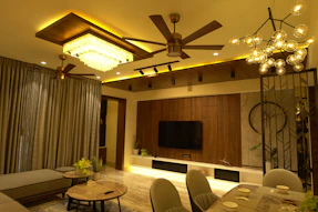 Warm glowing LED lights and stylish ceiling fans in a cozy living room.