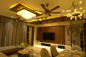 Installation of ceiling fan and lighting fixtures in a cozy living room.