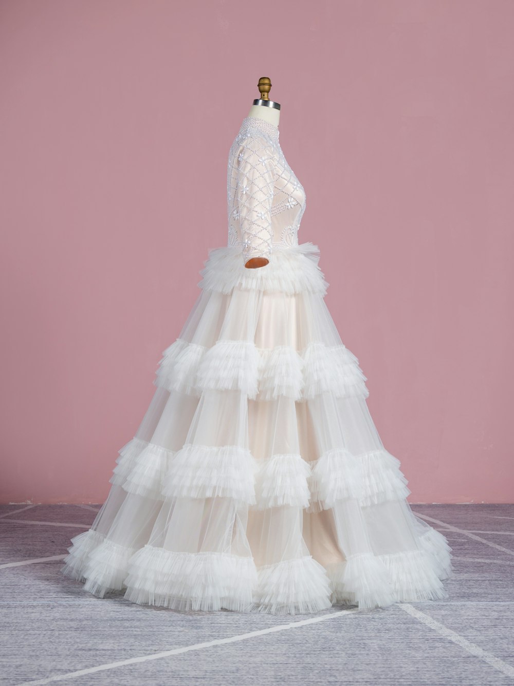 a white wedding dress on a mannequin