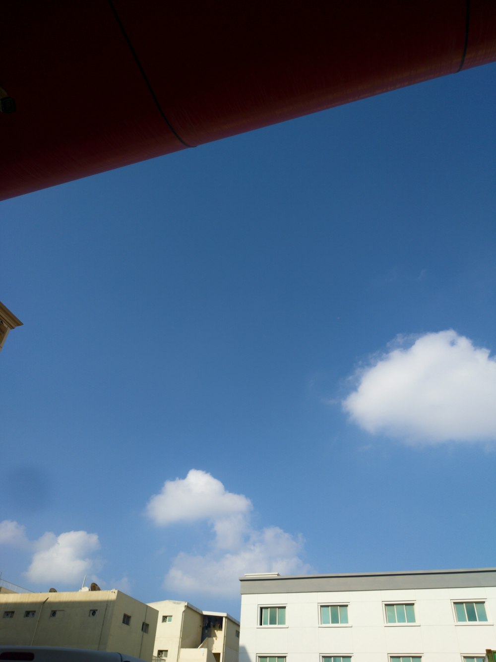 a view of a building from a parking lot