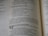 A close-up view of text from an open book, focusing on verses and prophecies from a religious script. The page numbers and chapters are visible, with some parts of the text emphasized in bold.