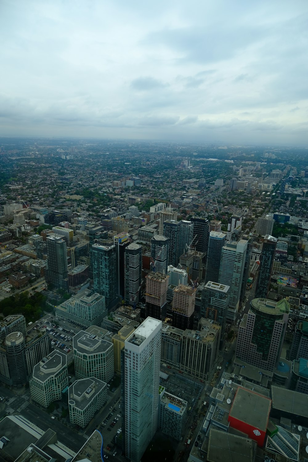 an aerial view of a city with tall buildings