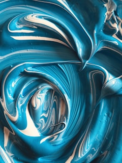 a close up of a blue and white swirl
