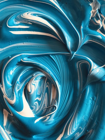 a close up of a blue and white swirl