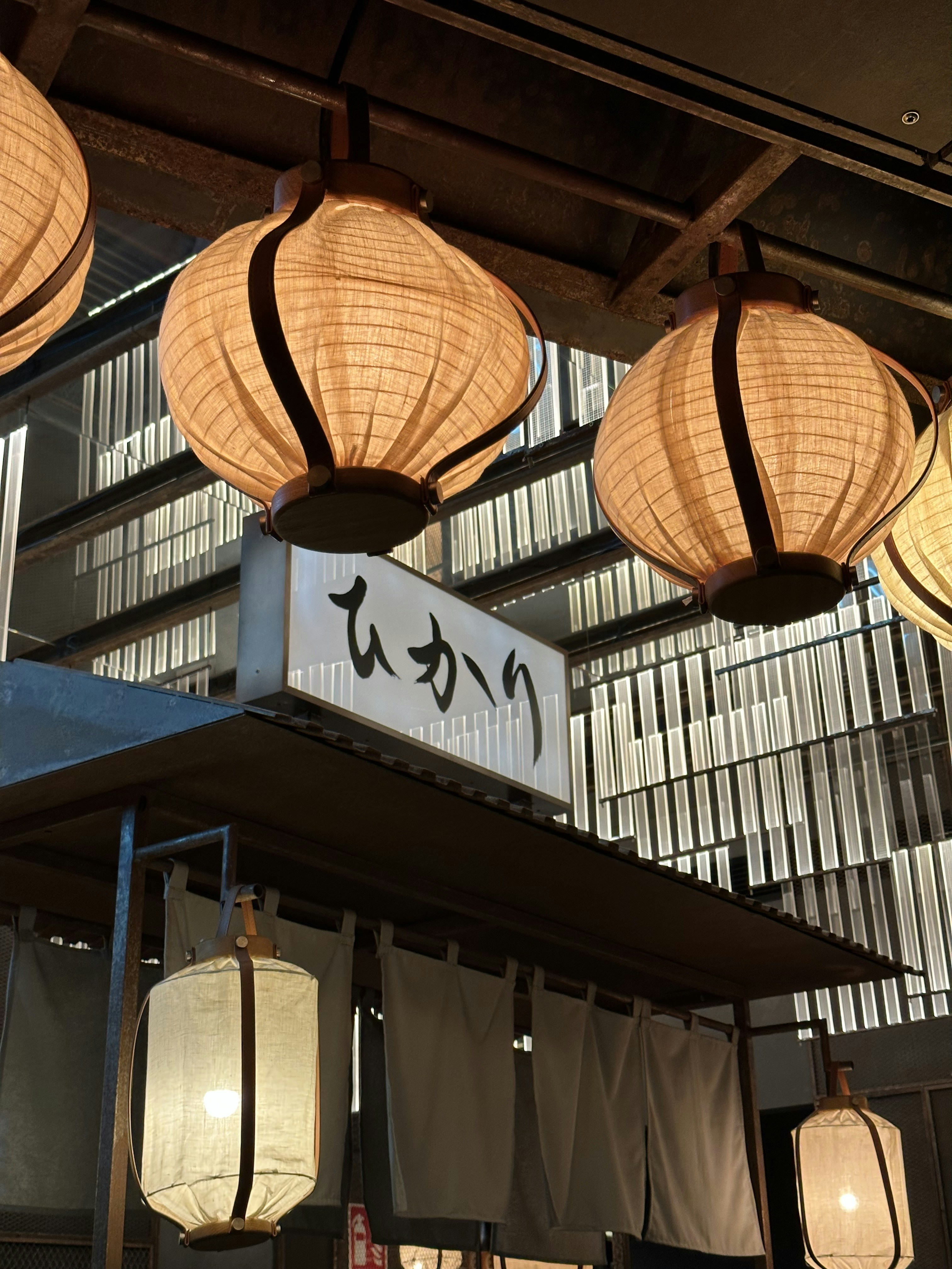 a number of lights hanging from a ceiling