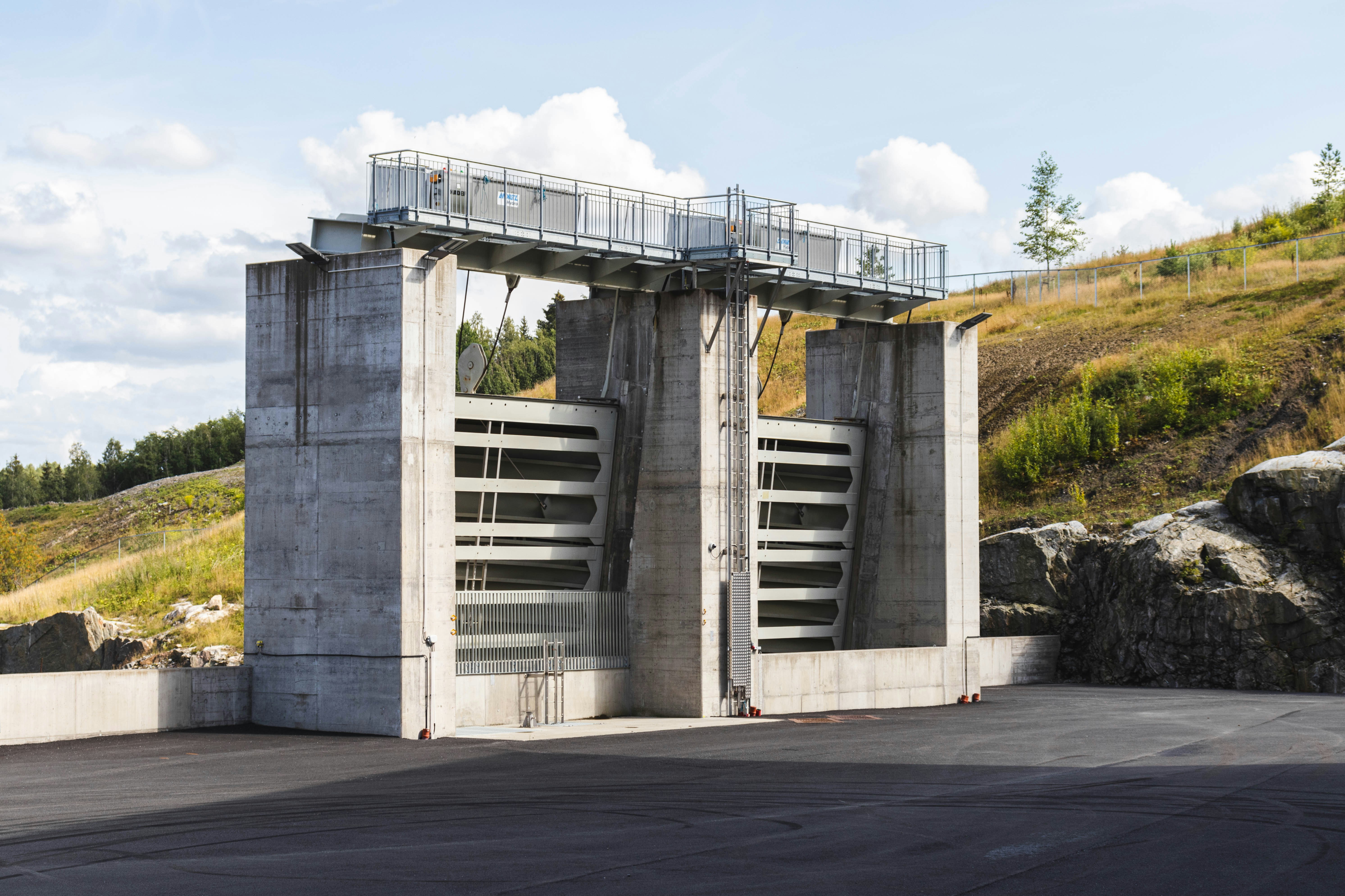 a concrete structure with a walkway going up the side of it