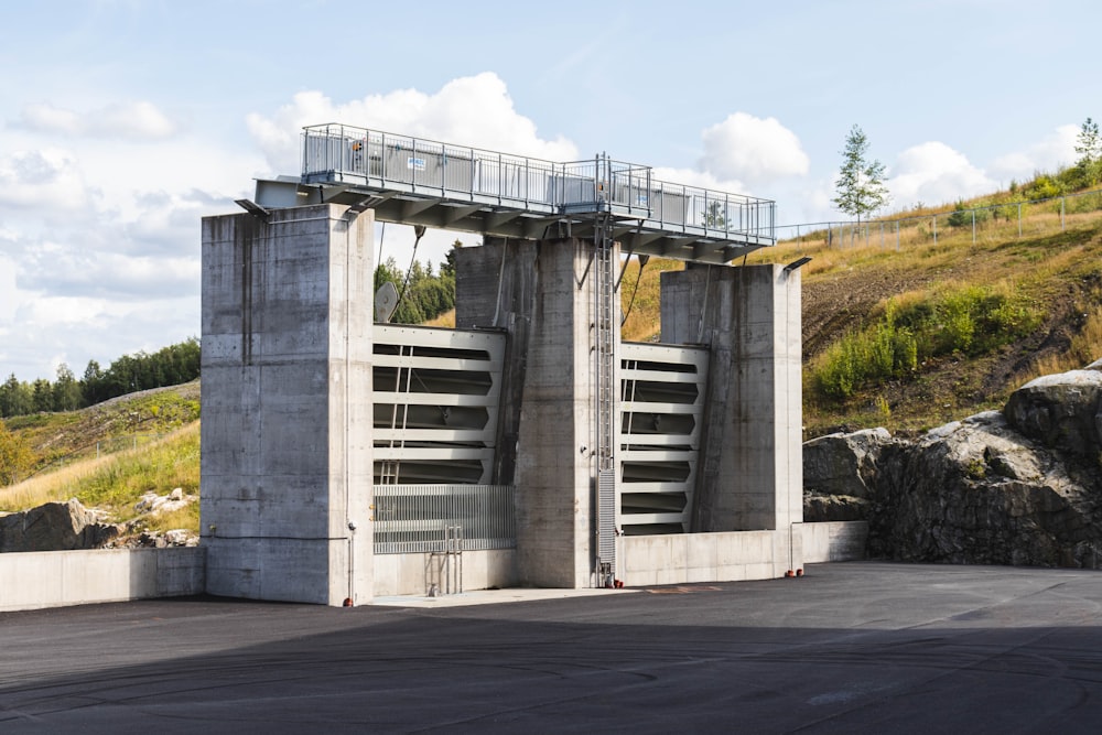 a concrete structure with a walkway going up the side of it