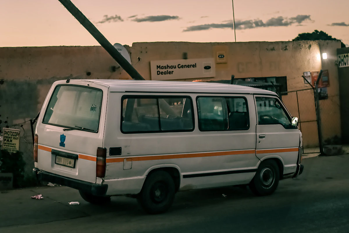 White van parked on the side of a road