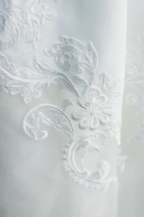 Delicate embroidery details on a high-end intimate dress.
