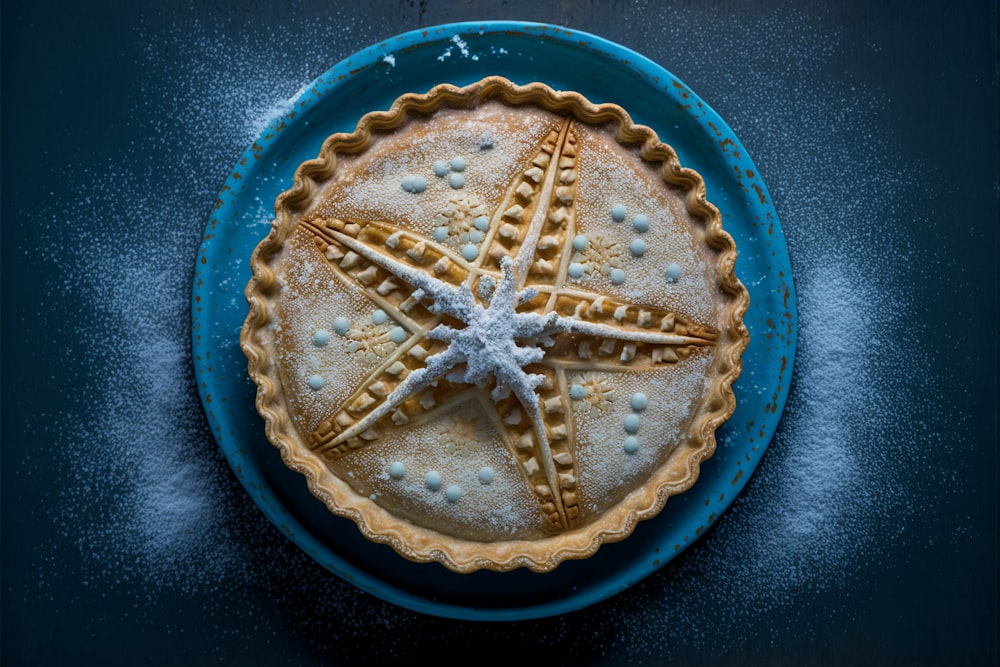 a blue plate topped with a starfish pie