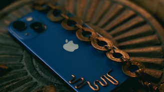 Stylish iPhone with a unique chain-decorated fashion cover in deep blue.