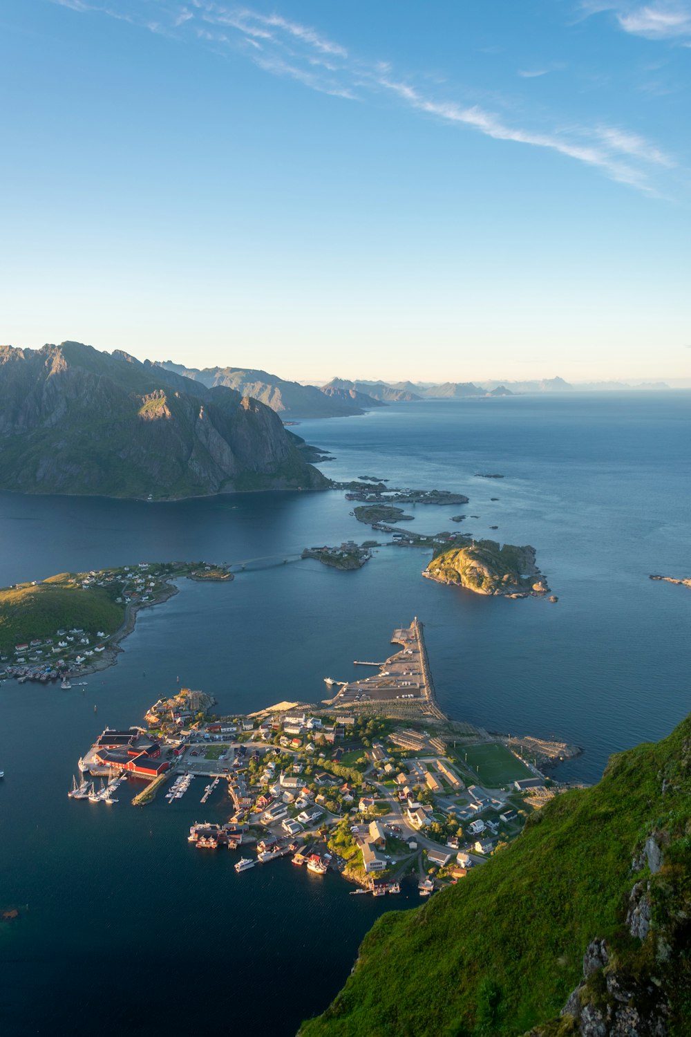 a bird's eye view of a small town and a body of water