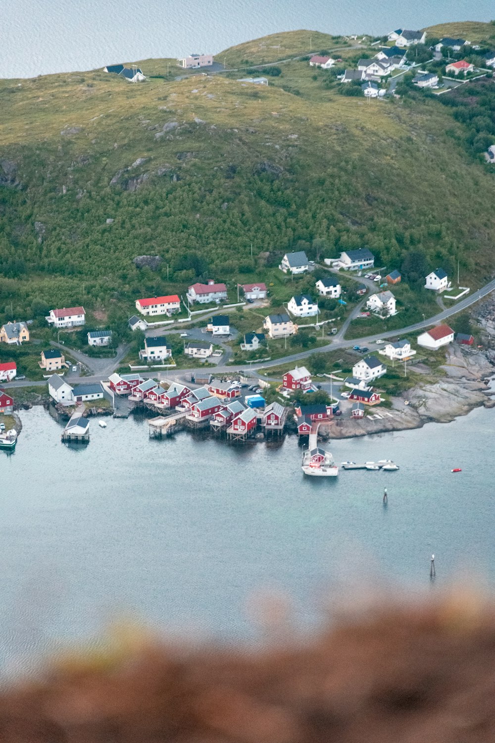 an aerial view of a small town on the water