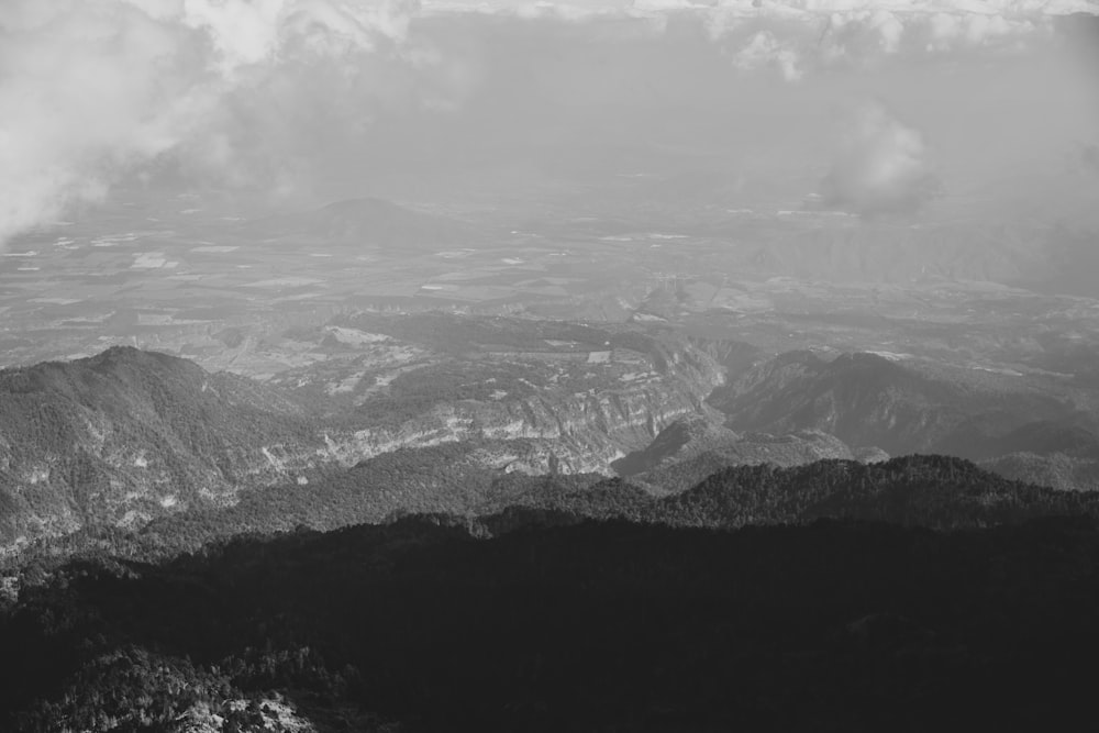 a black and white photo of a mountain range