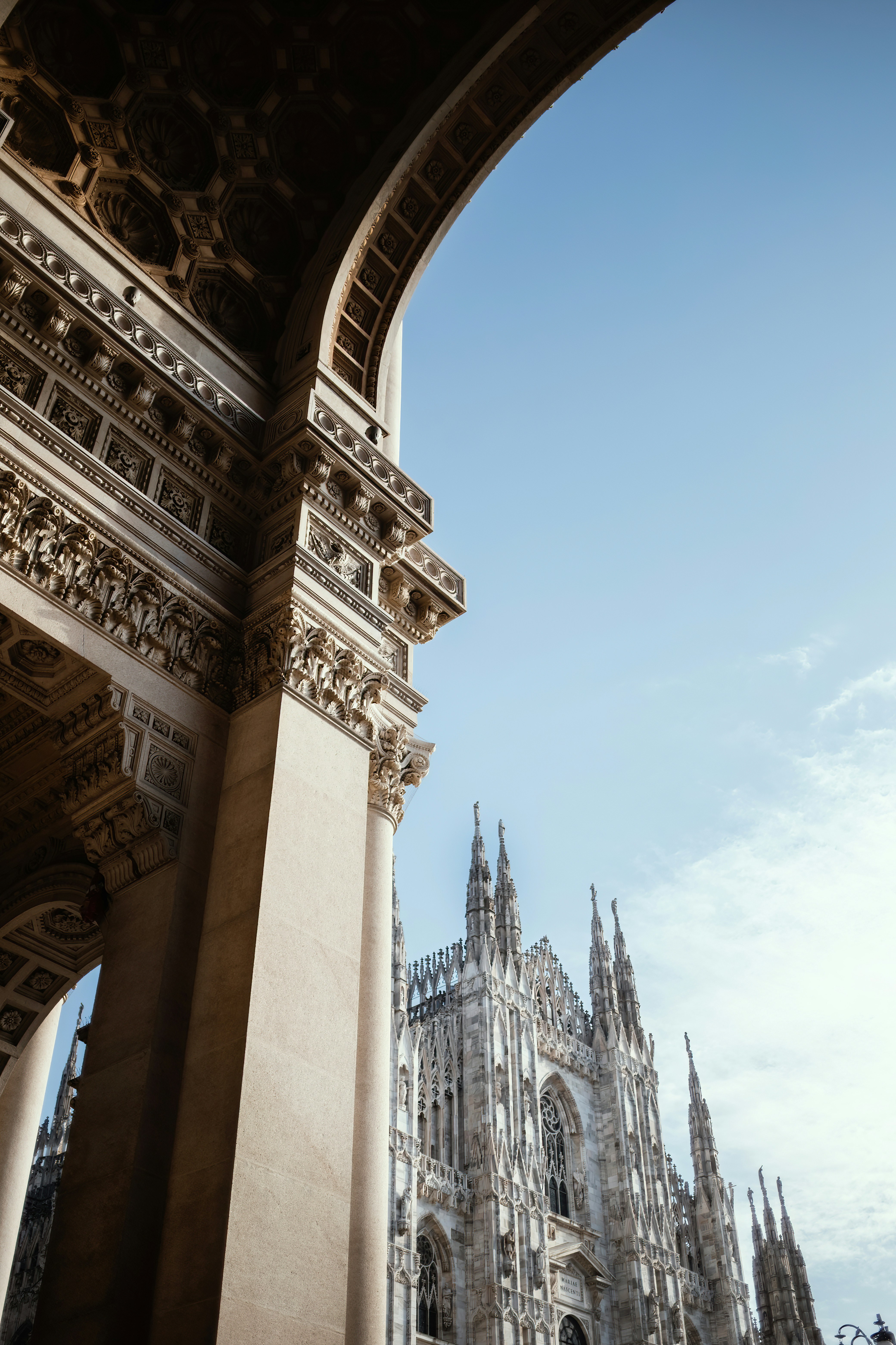 a large cathedral with a clock tower in the background