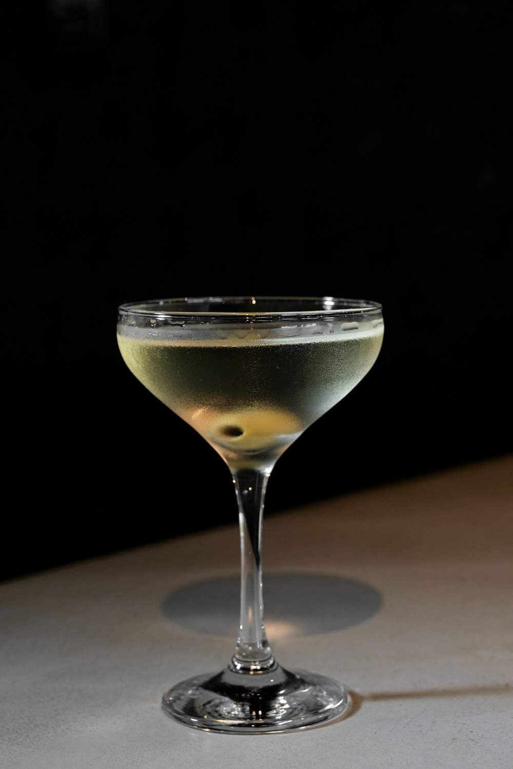 a close up of a wine glass on a table