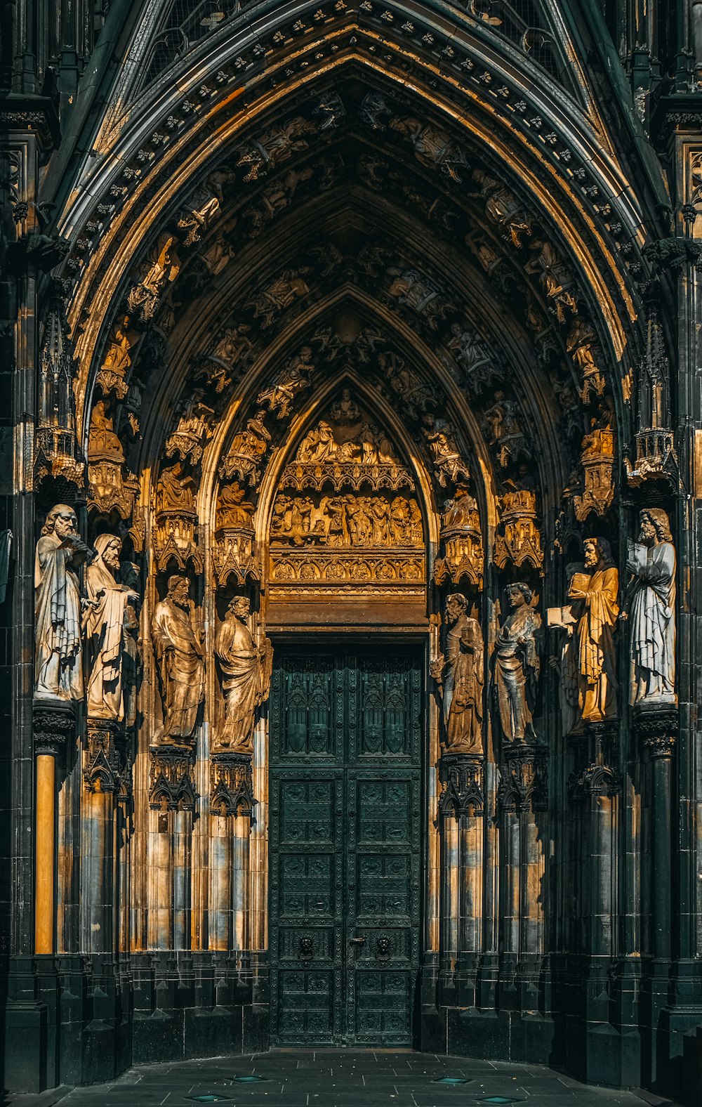 a large cathedral with statues on the front of it