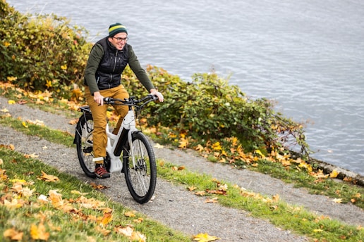 A happy cyclist riding a bike along a scenic route in Ludbreg.