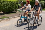 A group of diverse riders enjoying a sunny day on e-bikes.