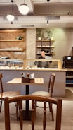 A cozy cafe interior featuring stylish furniture and decor.