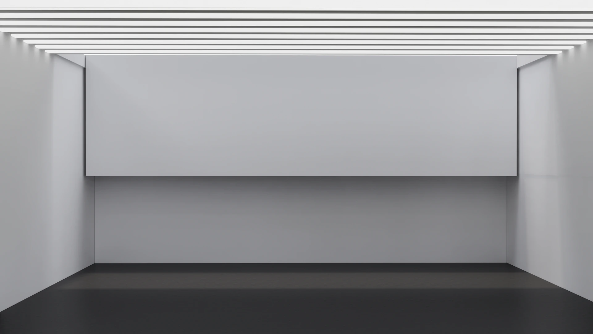 an empty room with white walls and a black floor