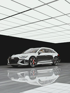 Polished car exterior reflecting the minimalist, modern workshop environment with hexagonal motifs subtly visible