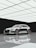 A beautifully finished metallic resin floor reflecting light in a modern garage.