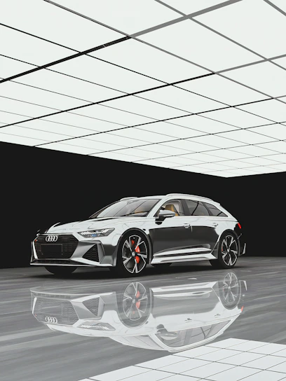 Sleek modern automotive workshop interior with metallic details and sophisticated lighting.