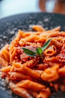 a close up of a plate of food with pasta