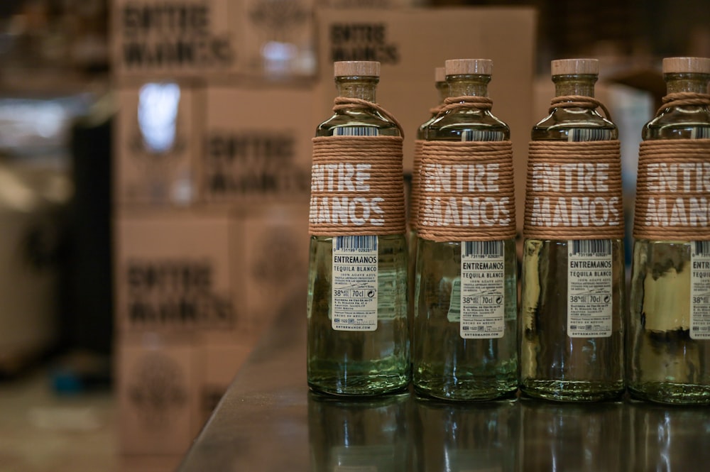 a group of three bottles sitting on top of a table