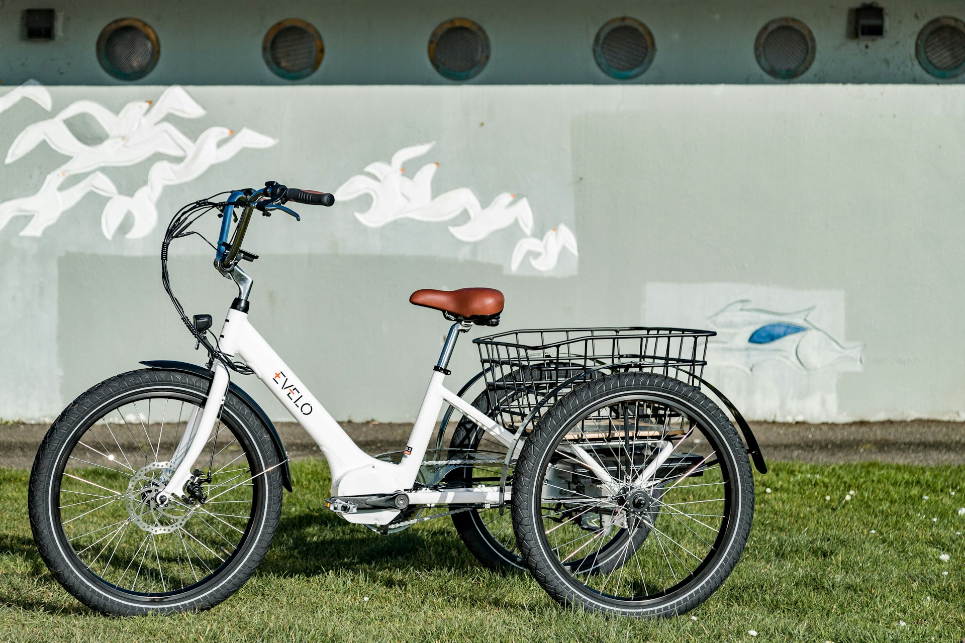An inviting front porch scene with an electric tricycle parked nearby, ready for a relaxed neighborhood ride.