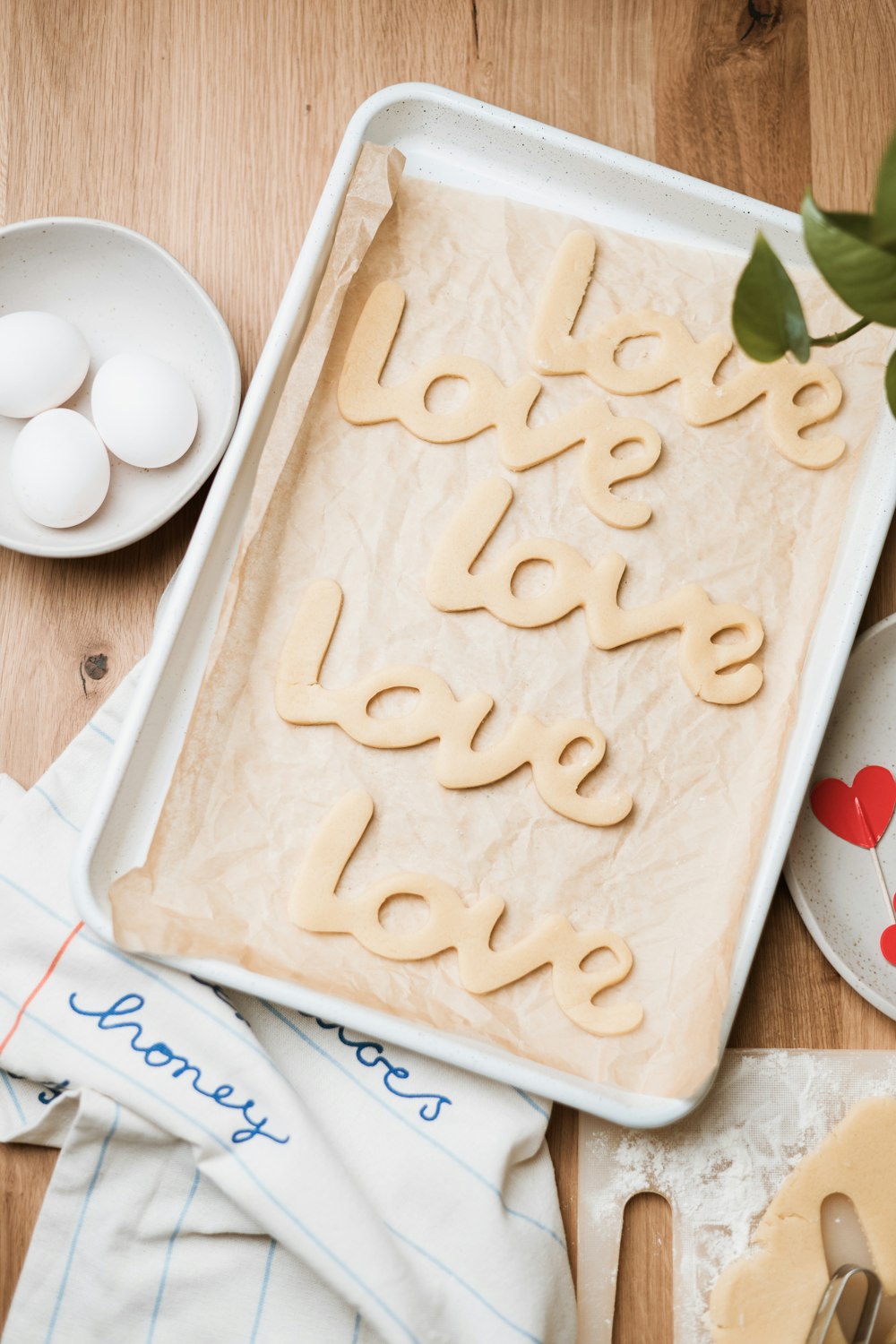 a baking sheet with the words love spelled on it