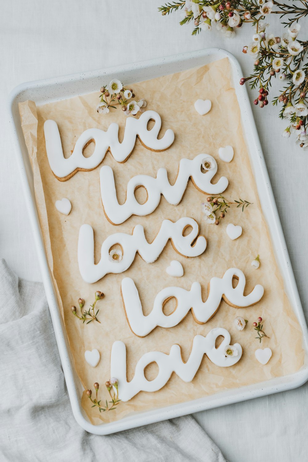 a cookie with the words love spelled out on it